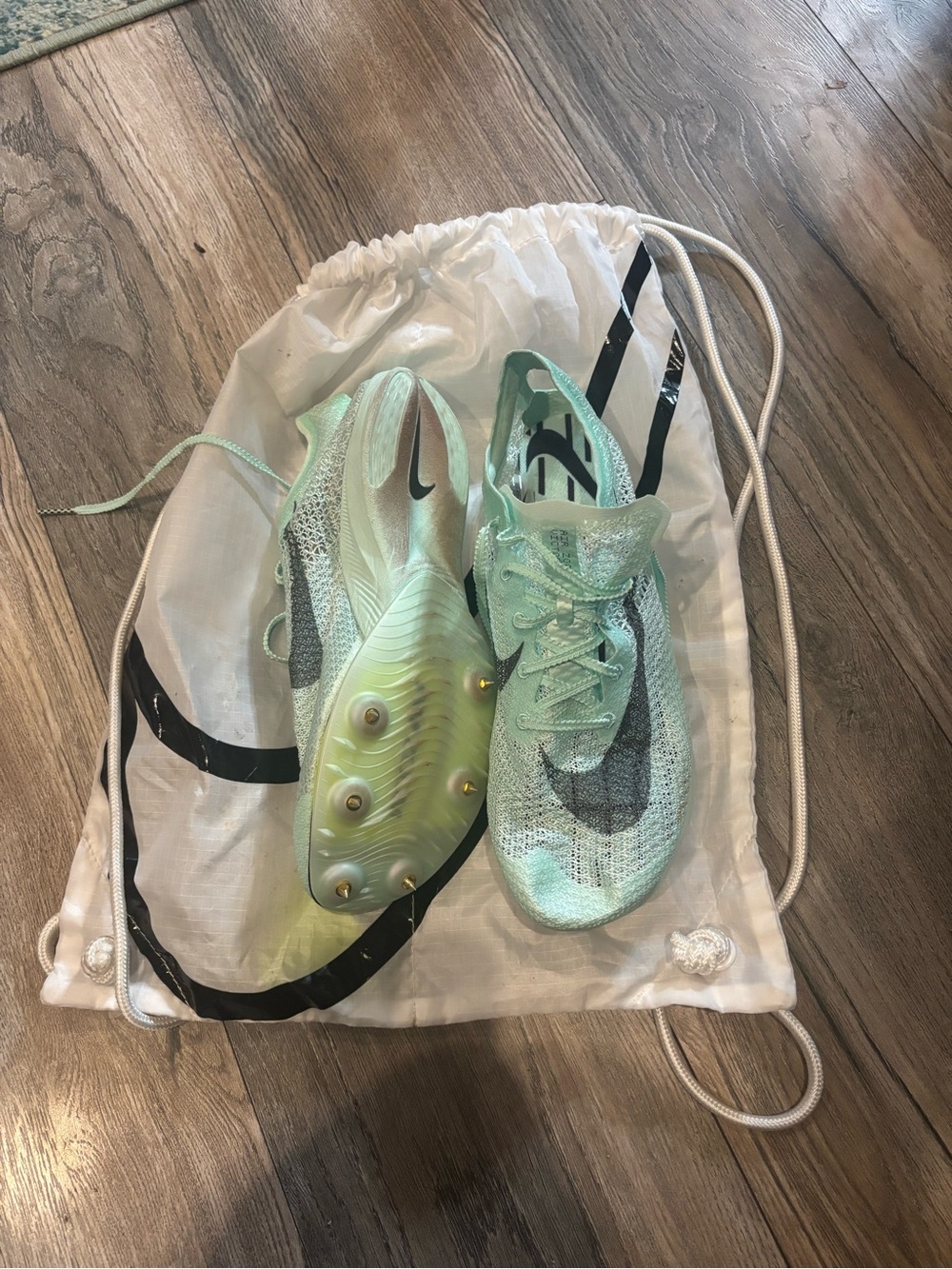 Nike Mint Teal Track Cleats with Black Swoosh